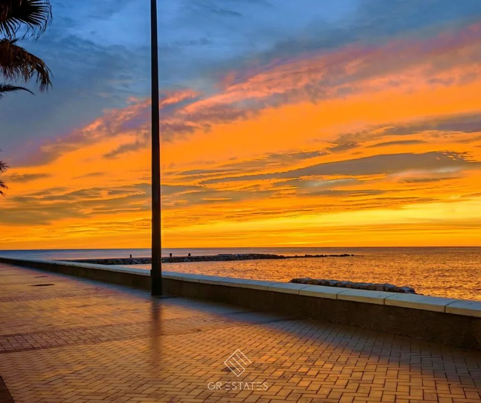 Golden autumn sunset over the Paseo Marítimo promenade and the Mediterranean in Fuengirola